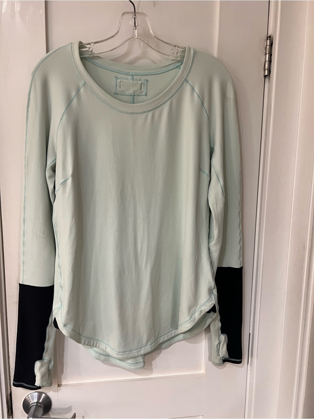 Lululemon- size L- Mint Long Sleeve Top, Black Cuff Detail and thumb holes